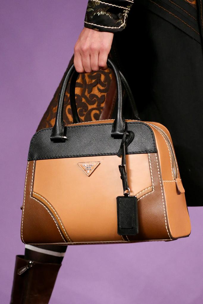 Prada Spring 2015 Runway Bag Collection featured Bowlers and Top Handles Spotted Fashion