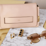 Chloe Blush Nude Elle Clutch Bag / Pear Darcy Square Ring / Black Djill Brass Ring / Dafne Sunglasses / Gold Erika Brass Cuff